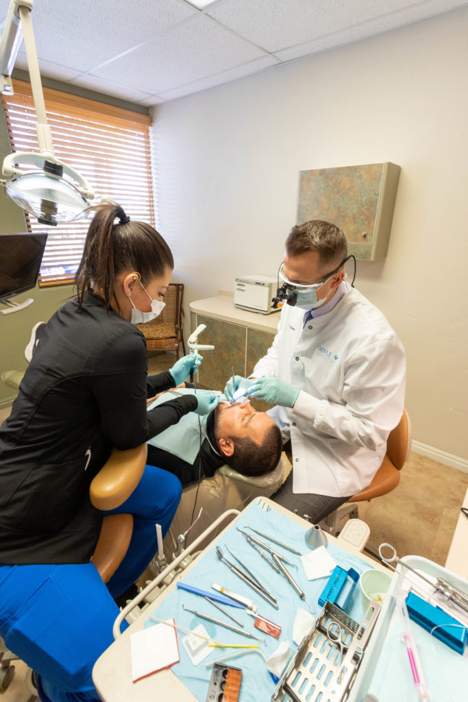 Anxious patient receiving dental sedation with laughing gas in St. George.