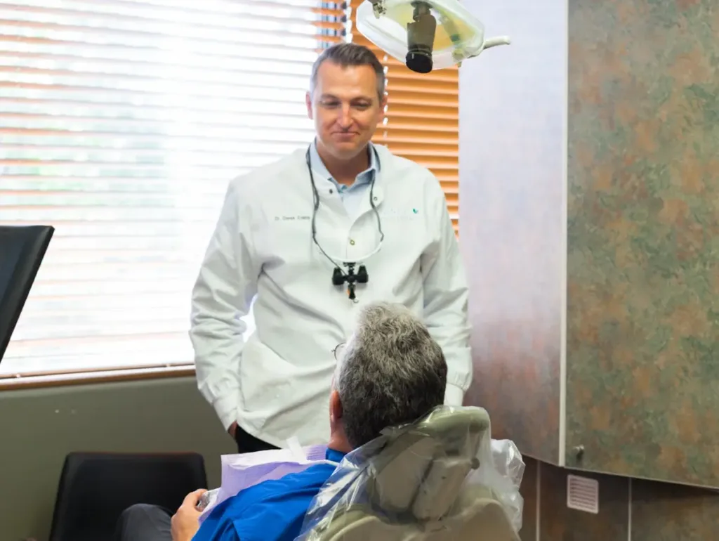 Our dentist with a patient during a smile consultation